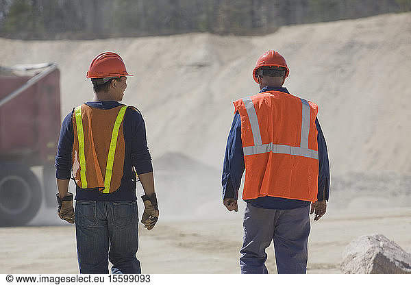 Two engineers at a gravel and asphalt plant