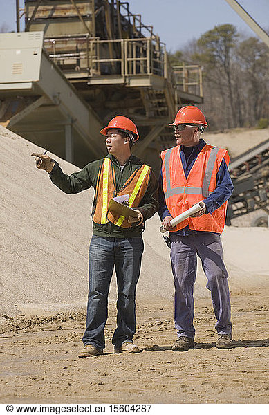 Two engineers planning at a gravel and asphalt plant