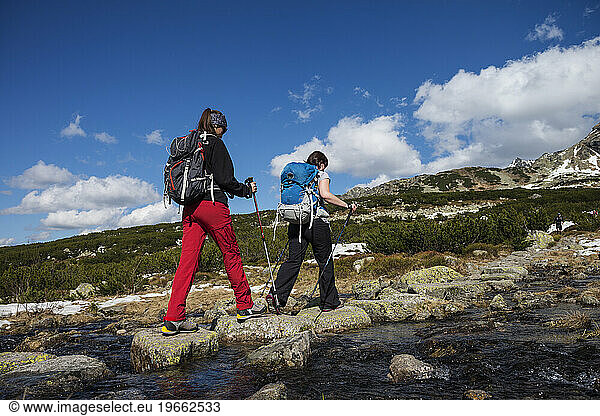Two female hikers hiking in Tatra mountains  Poland