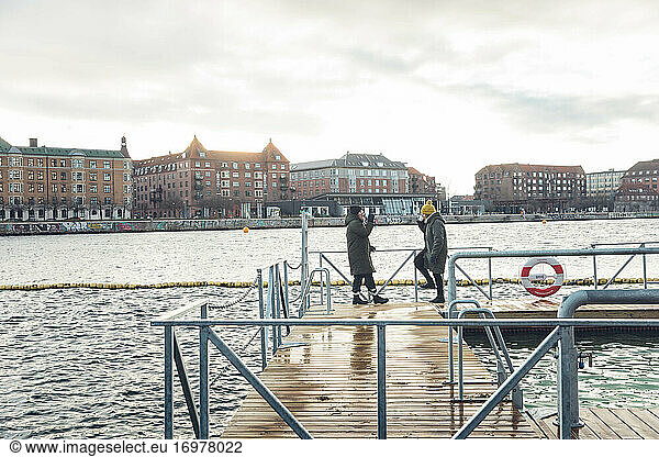 Two Friends Sipping Coffee After Cold Swim in Copenhagen Denmar