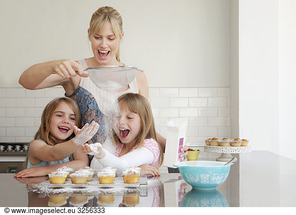 Two girls and a mum baking
