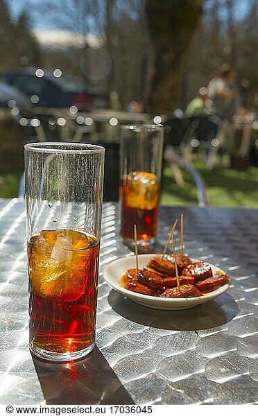 Two glasses of vermouth with tapa. Spain.