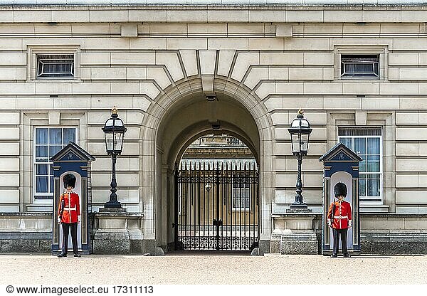 Two guards in front of guard house  Royal Guard guards with bearskin cap  Buckingham Palace  London  England  Great Britain