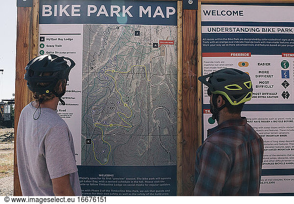 Two guys look at the map at the Timberline Bike Park in Oregon.