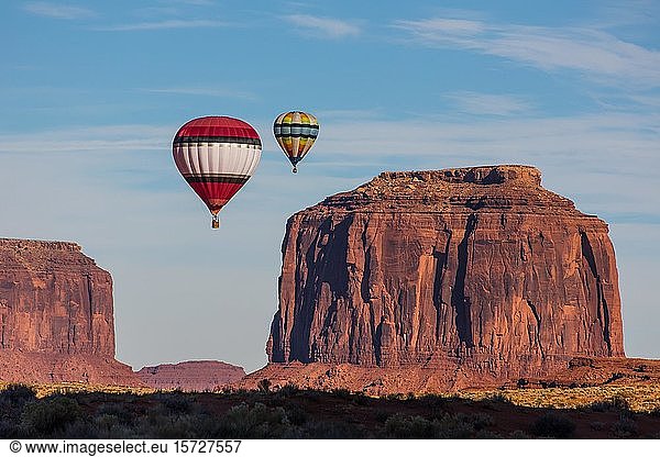 Two hot air balloons fly over Merrick Butte  Balloon Festival in the Monument Valley  Monument Valley Navajo Tribal Park  Arizona  USA  North America