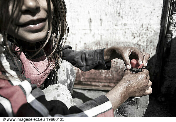 Two hundred souls in a handful of huts surrounded by plastic  sheet metal and garbage. They are gipsy.