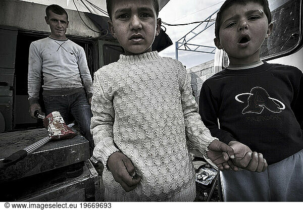 Two hundred souls in a handful of huts surrounded by plastic  sheet metal and garbage. They are gipsy.