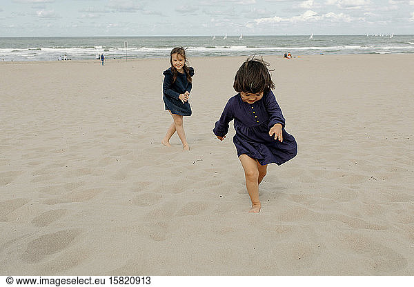 Two little girls playing on the beach  Scheveningen  Netherlands