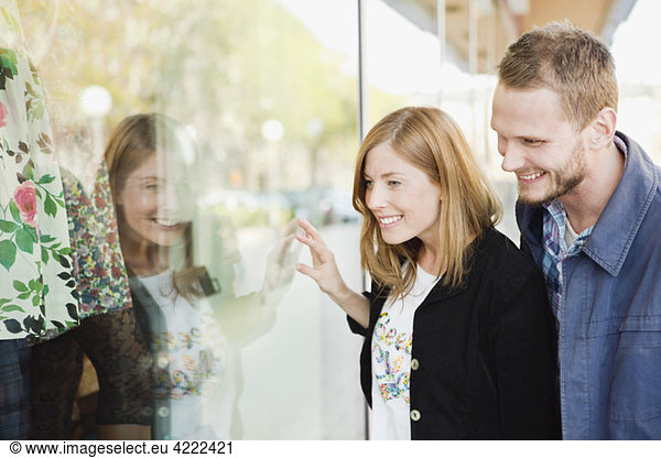Two looking through display window