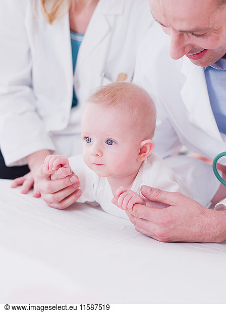 two medics tending to a baby
