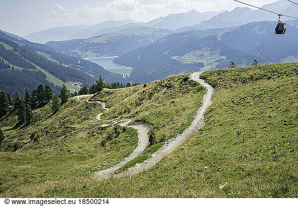 Two mountain bikers riding on uphill  Zillertal  Tyrol  Austria