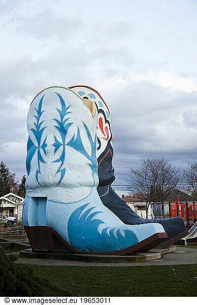 Two oversized cowboy boots in a small park in Seattle.