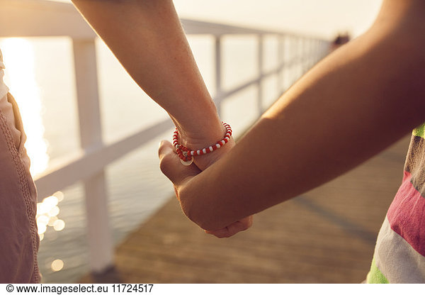 Two people holding hands