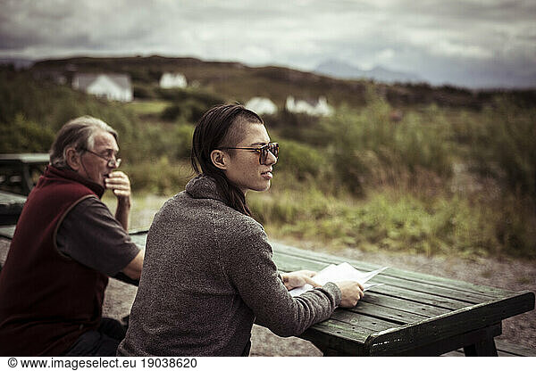 two people look out at view of mountains in scotland