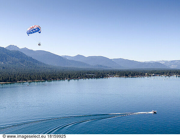 Two people parasailing in South Lake Tahoe  California.