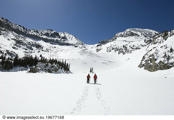 Two people snowshoeing on Cameron Pass  Colorado.