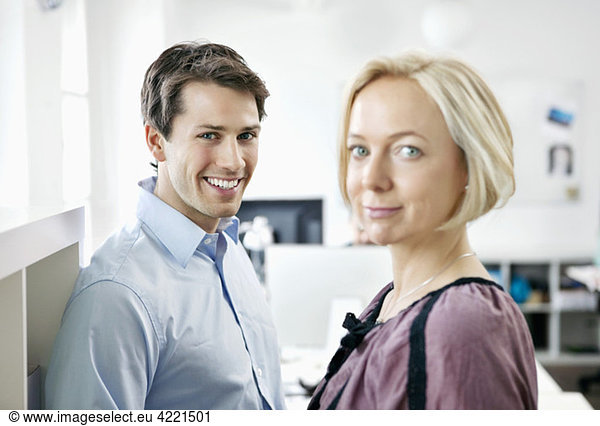 Two people standing at the office