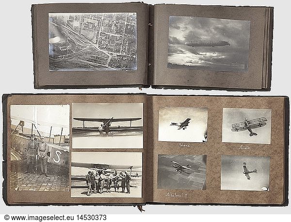 Two photograph albums  of an observer of the Imperial German Army Air Service On the front side superimposed Prussian oberserver badge made of cardboard. Albums with altogether more than 300 pictures of a Prussian officer of the Imperial German Army Air Service. Including very interesting photographs of different types of aircrafts  accommodations  country and people  airships  aircraft accidents etc. Numerous aerial photographs of the front line and various airfields along the front. Few of the photographs derive from the twenties  among others of aircrafts of the Flugtechnisches Forschungsinstitut Hannover (aeronautical research institute Hanover)  historic  historical  1910s  20th century  troop  troops  armed forces  military  militaria  army  wing  group  air force  air forces  object  objects  stills  clipping  clippings  cut out  cut-out  cut-outs