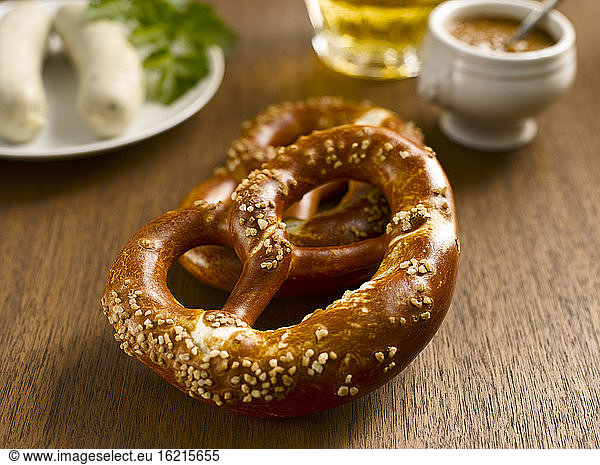 Two pretzels with german Weißwurst and sweet mustard