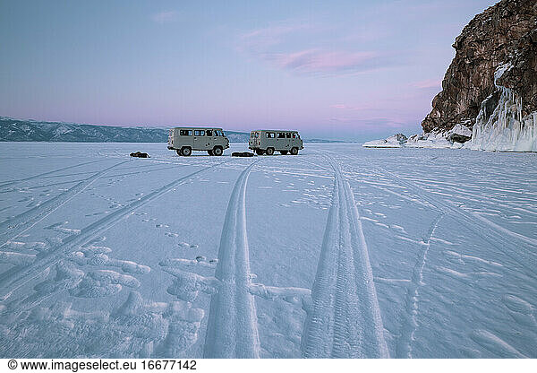 two russian vans over icy lake