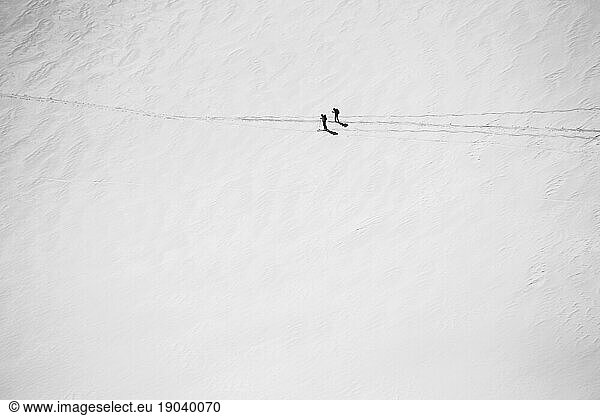 Two Skiers In The Backcountry From Above in British Columbia Canada