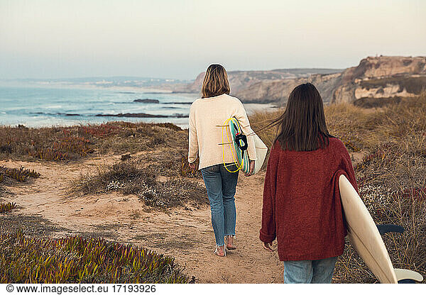 Two Surfer girls going surf