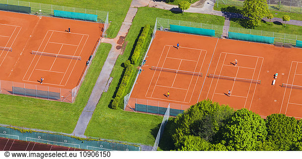 Two tennis courts seen from above
