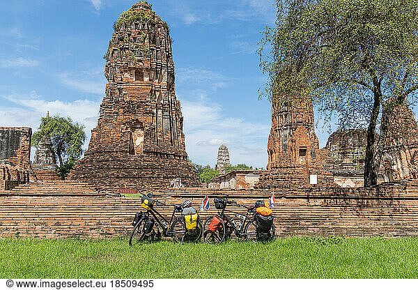 two touring bikes loaded with bags at Bueng Phra Ram Park temple