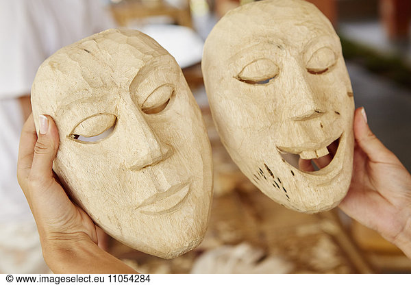 Two traditional wooden face masks  freshly carved.