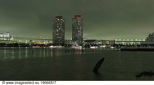 Two twin buildings stand tall on the edge of Tokyo Bay  Japan.