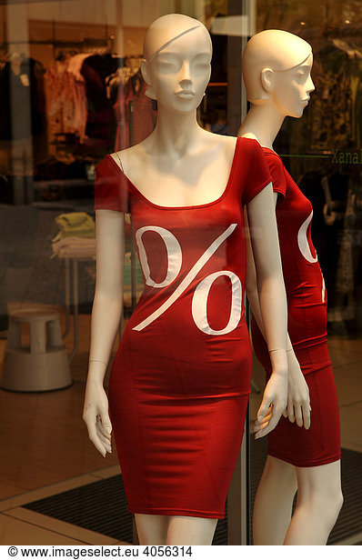 Two white shop window dolls mannequin wearing red dresses in the SSV  Summer Clearance Sales  Nuremberg  Middle Franconia  Bavaria  Germany  Europe