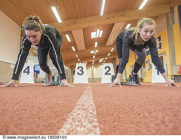 Two women runners on tartan track in starting position  Offenburg  Baden-Württemberg  Germany