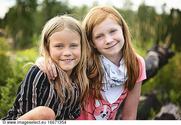 Two Young Girls Playing Outdoors