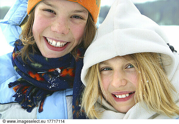 Two Young Girls Smiling Outside In Winter  Quebec
