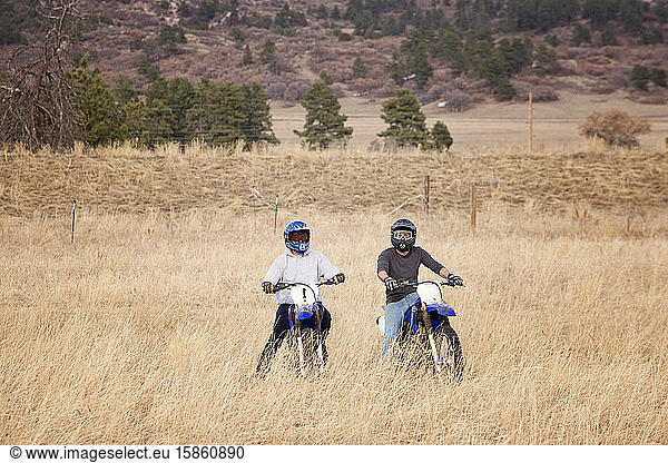 Two Young Men Dirt Biking in the Foothills in Colorado