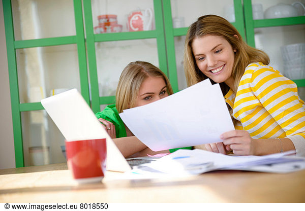 Two young women working from home