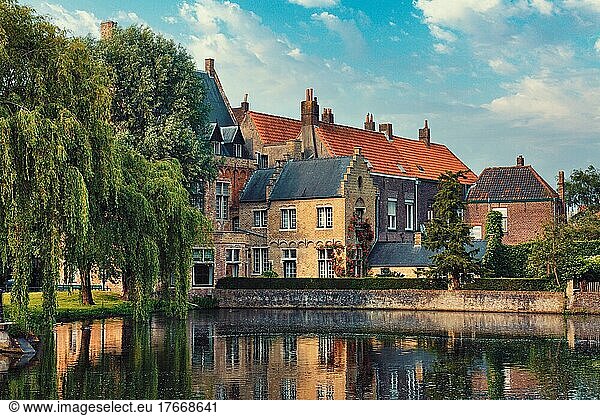 Typical Belgian cityscape Europe tourism concept  canal and old houses on sunset  Bruges (Brugge)  Belgium