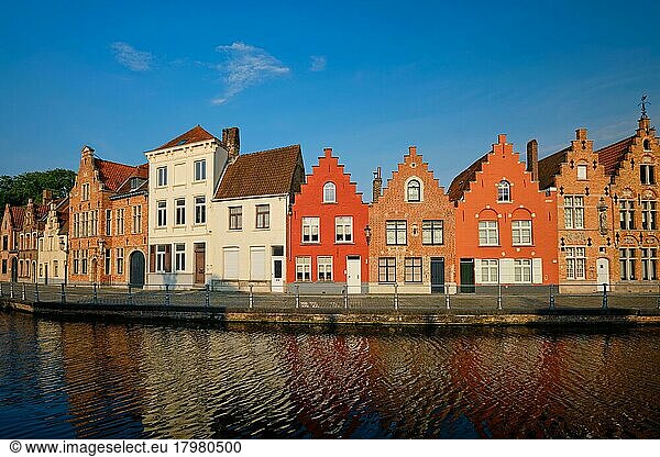 Typical Belgian cityscape Europe tourism concept  canal and old houses on sunset. Bruges (Brugge)  Belgium