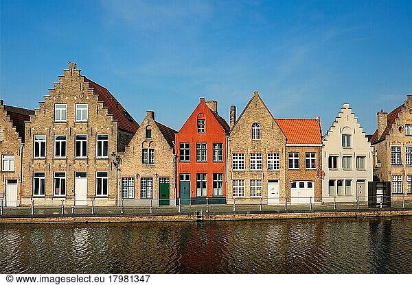 Typical Belgian cityscape Europe tourism concept  canal and old houses on sunset. Bruges (Brugge)  Belgium