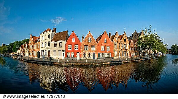 Typical Belgian cityscape Europe tourism concept  panorama of canal and old houses on sunset. Bruges (Brugge)  Belgium