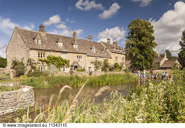 Typical Cotswolds stone houses in Lower Slaughter  Gloucestershire  England  United Kingdom  Europe