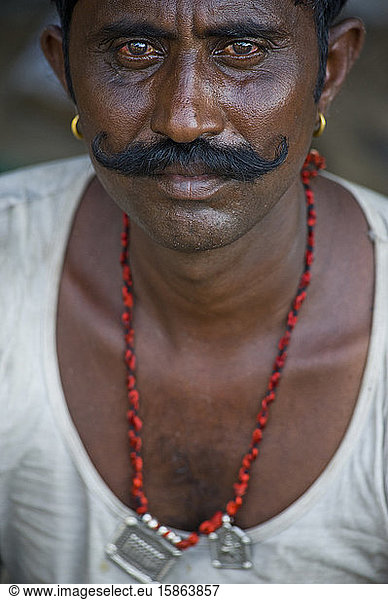 Typical Rajasthani man with big black mustache and earrings