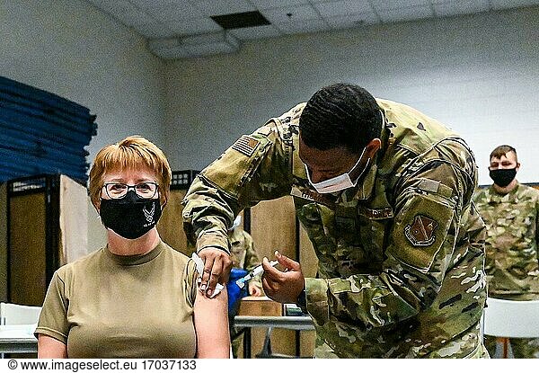 U. S. Air Force Staff Sergeant Kelvin Thomas  316th Medical Squadron noncommissioned officer in charge of immunizations  administers the Moderna Covid-19 vaccination to U. S. Air Force Lieutenant General Dorothy A. Hogg  U. S. Air Force and U. S. Space Force Surgeon General  at Joint Base Anacostia-Bolling  Washington D. C.   Jan. 6  2021. As initial quantities of the vaccine are limited  medical  fire department and security forces professionals are the first at JBAB to be offered the vaccine in line with the Department of Defense phased prioritization plan. When available  the DOD will ensure the vaccine is available for all beneficiaries. (U. S. Air Force photo by Tech. Sgt. Corey Hook).