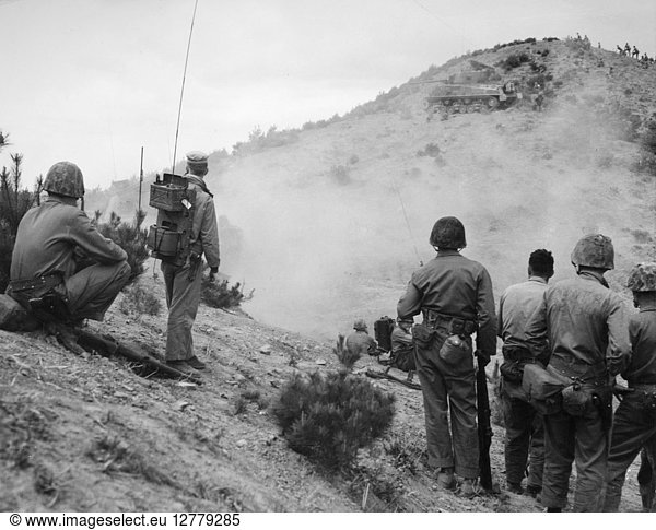 U.S. MARINES: LEATHERNECKS. Leathernecks of the Seventh Marine Regiment observe direct tank fire against enemy positions on the front in Korea n.d.