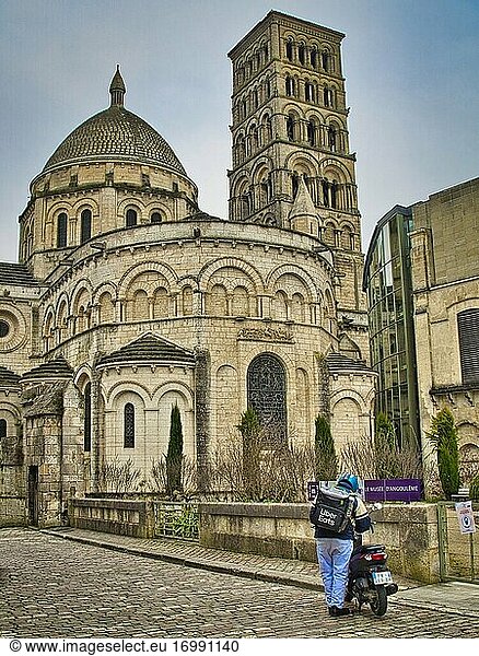 Uber Eats delivery driver and motor scooter outside Angouleme Cathedral  Angouleme  Charente Department  Nouvelle-Aquitaine  France.