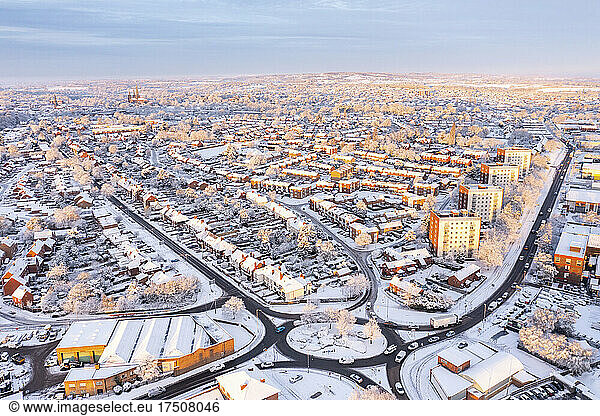 UK  England  Lichfield  Aerial view of snow-covered city at dusk