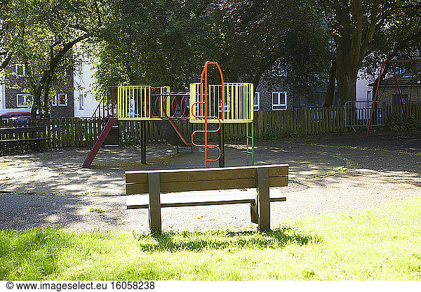 UK  England  London  Bench and jungle gym in empty playground