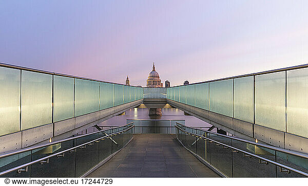 UK  England  London  Diminishing perspective of Millennium Bridge at dawn with Saint Pauls Cathedral in background
