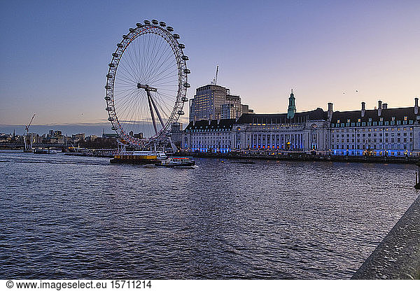 UK  England  London  London Eye and waterfront buildings at dawn