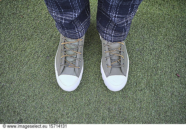 UK  England  London  Shoes of person standing on green grass